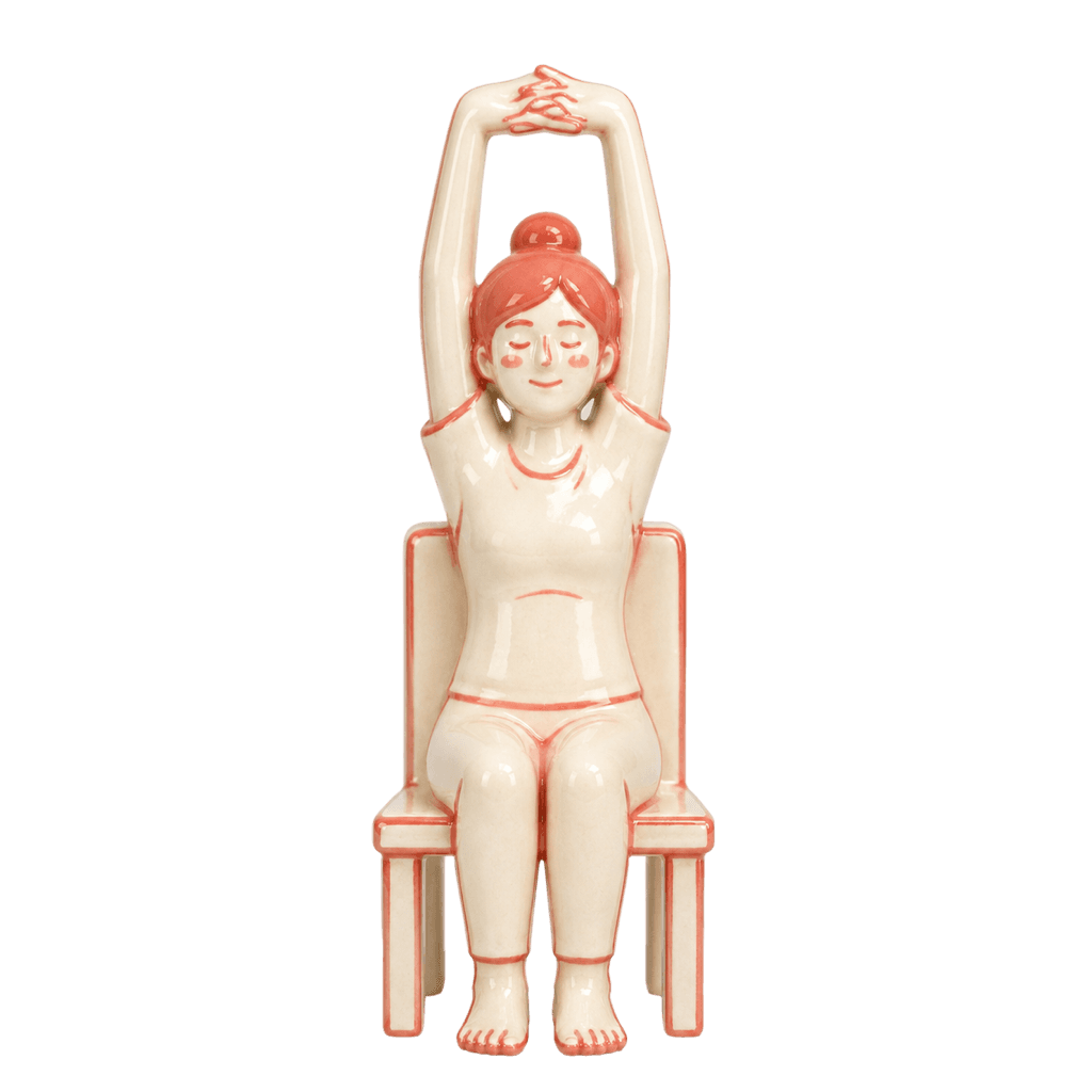 Ceramic figure demonstrating the Overhead Reach pose.