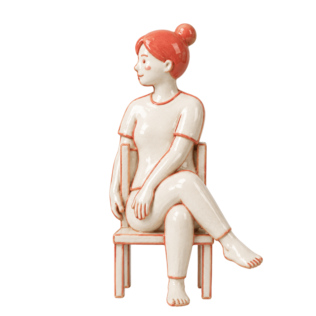 Ceramic figure demonstrating the Seated Spinal Twist pose.